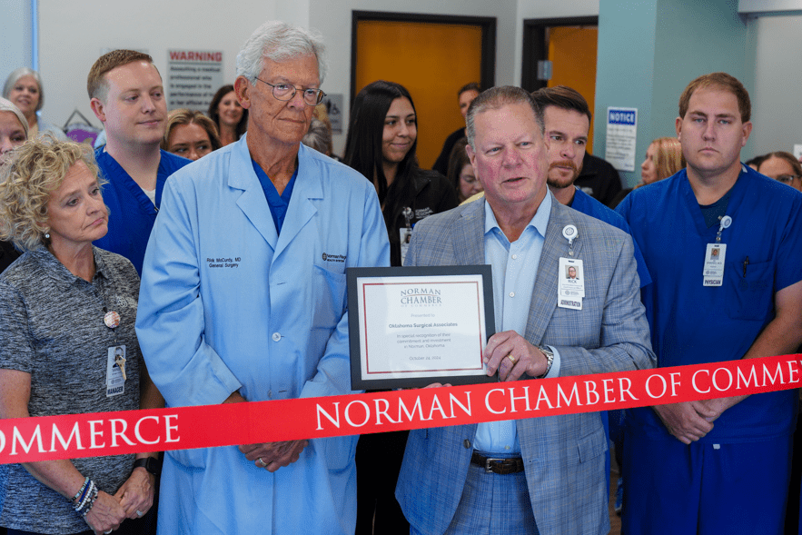 Oklahoma Surgical Associates Surgeon, Rick McCurdy, MD, and Norman Regional Co-Chief Executive Officer and Chief Financial Officer, Rick Wager, speak to the crowd